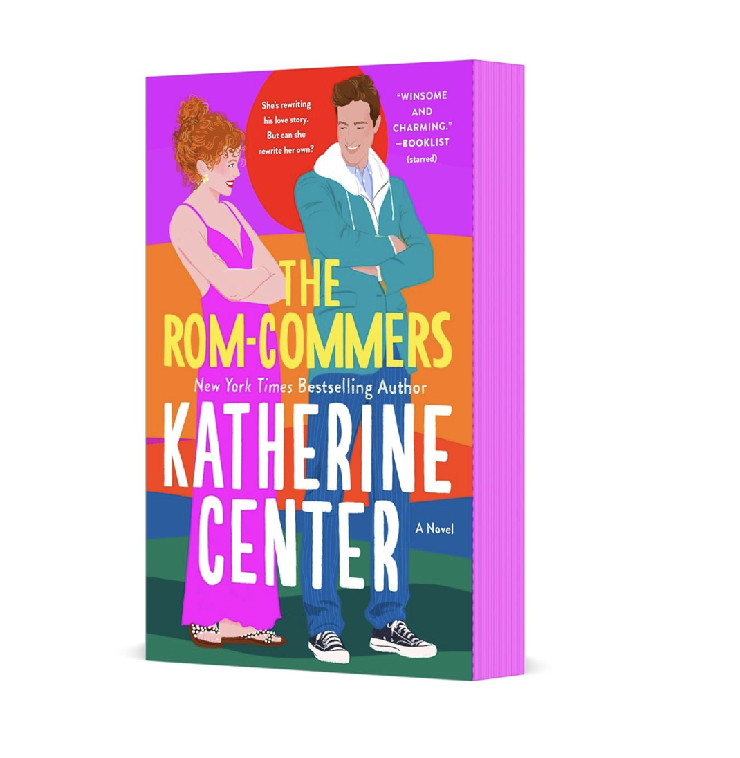 Cover of the book titled 'The Rom-Commers' by Katherine Center, featuring a illustrated woman with curly red hair and a man with brown hair wearing a blue hoodie, standing against a colorful background with quotes and praise.