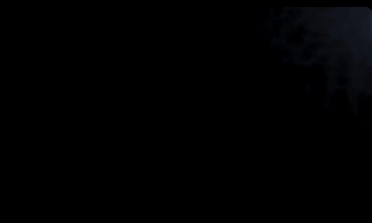 A dark image with a faint outline of a human skull on the right side and a black background.