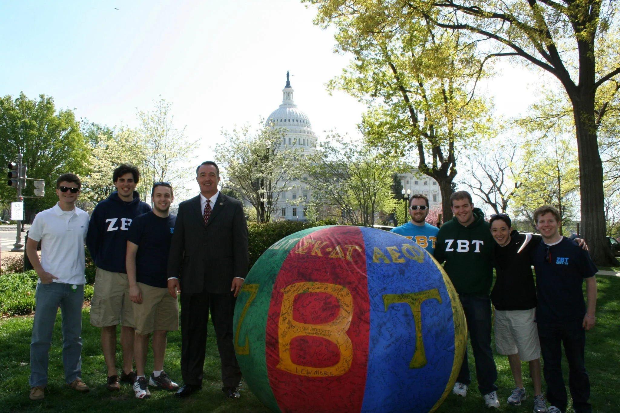 GW ZBT brothers with Representative Trent Franks standing on grass in front of the U.S. Capitol, alongside our philanthropic ball.