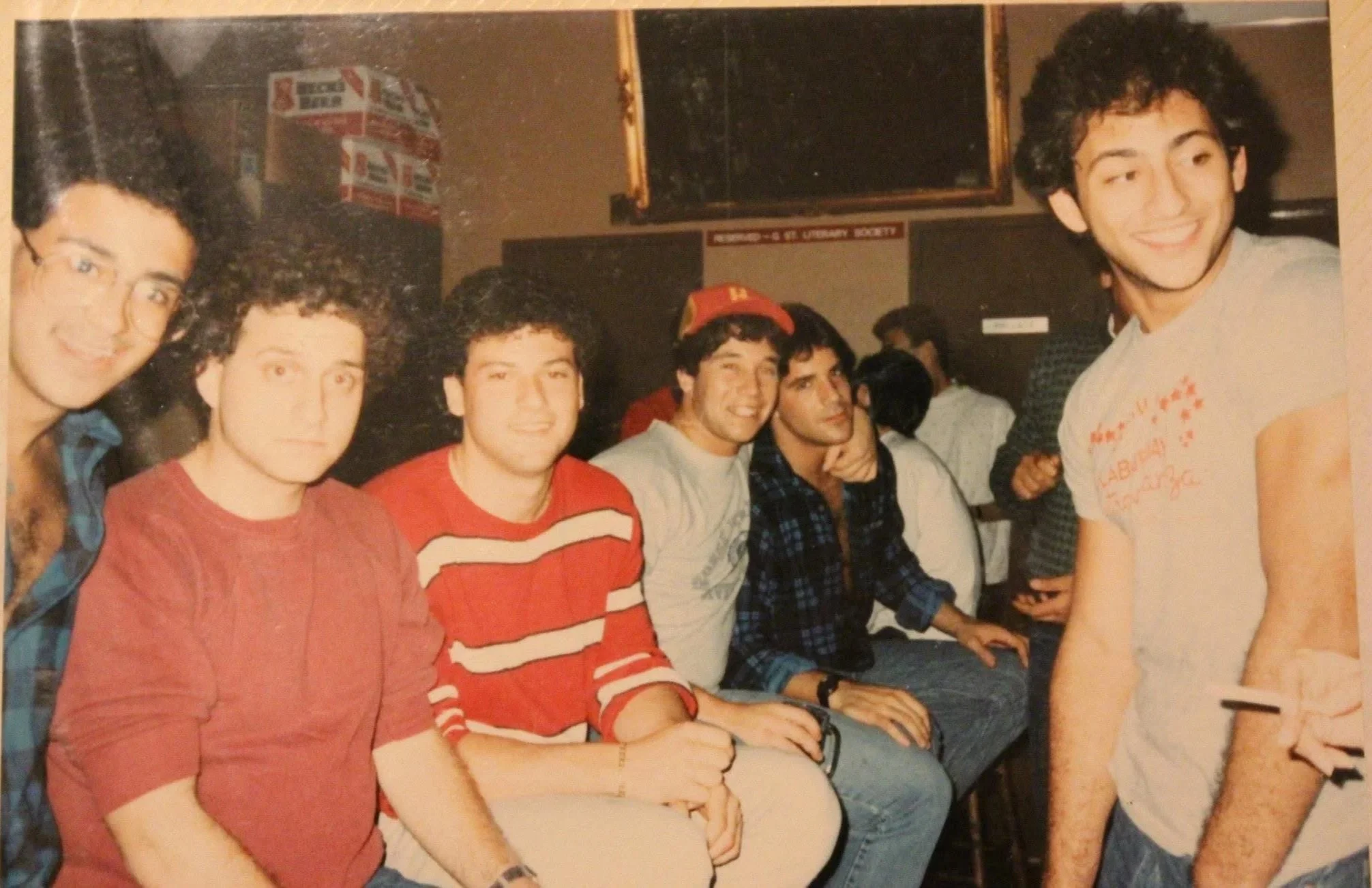 Fraternity brothers spending time together indoors.