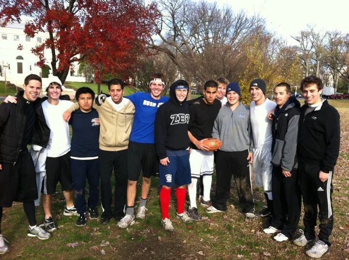 Fraternity brothers spending time together outside to play sports.