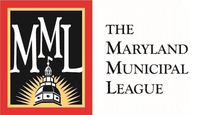 The Maryland Municipal League logo featuring white MML letters, a domed capitol building, and gold sun rays on a black and red background