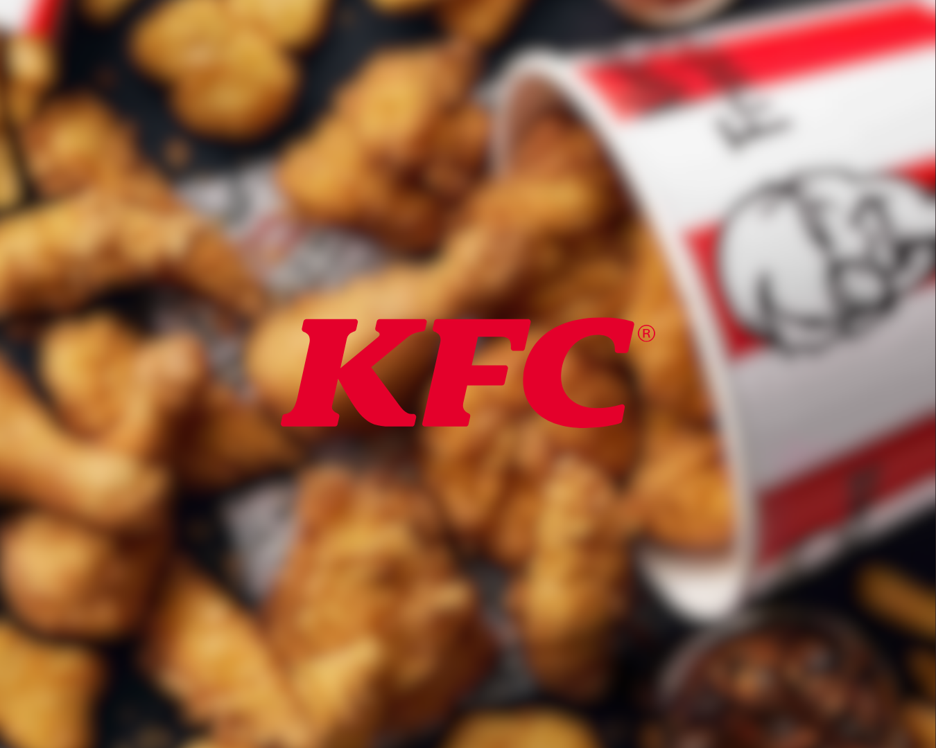Fried chicken pieces inside a KFC bucket.