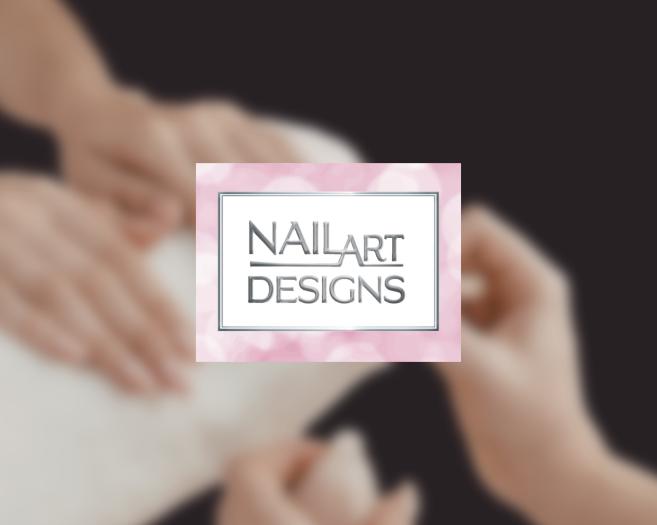 Close-up of a person receiving a manicure, with hands and nails being cared for, overlaid with a logo that says 'NAIL ART DESIGNS' in black text on a pink and white background.