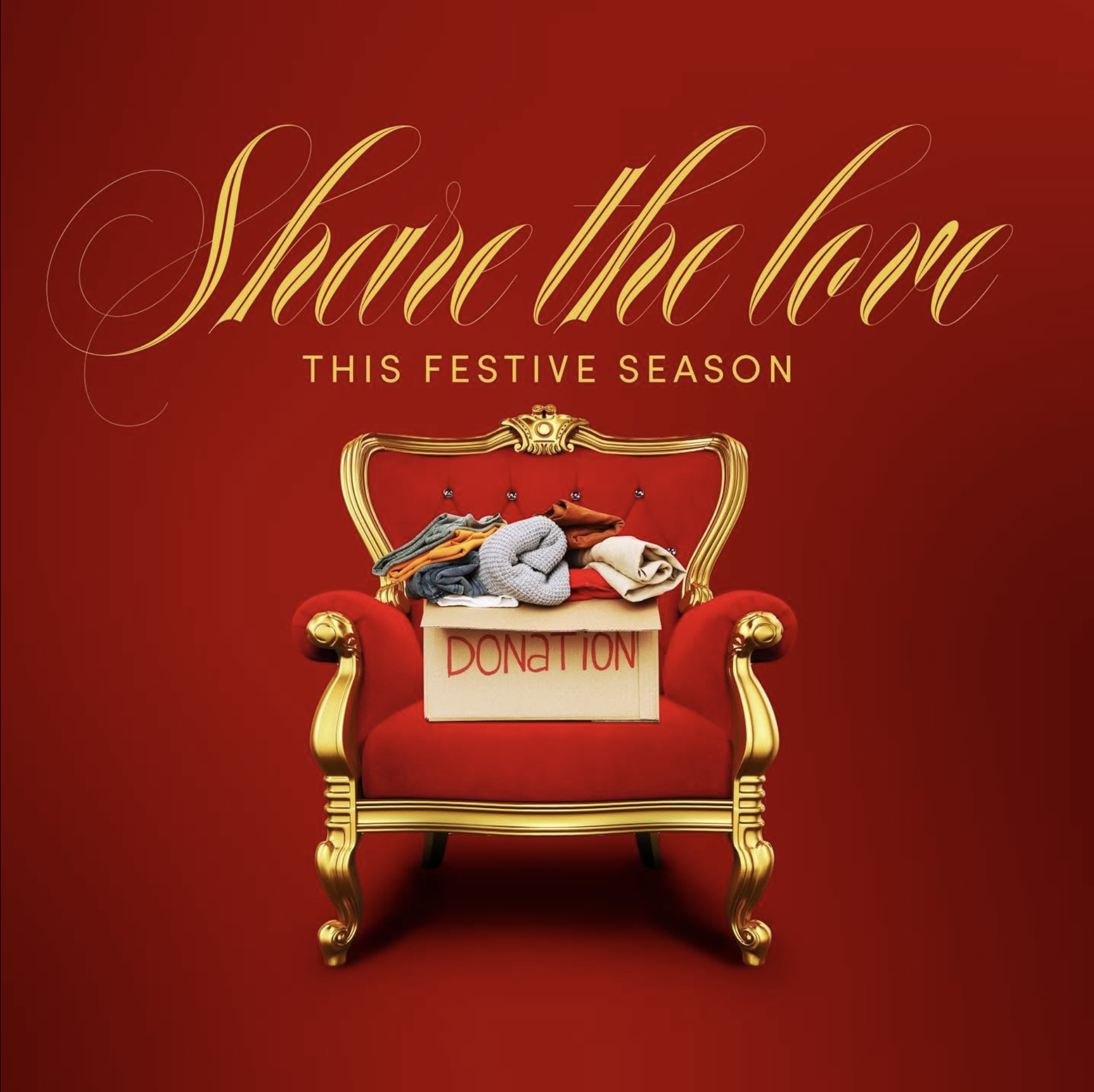 Red velvet armchair with gold trim and a box labeled 'donation' filled with folded clothes in front of a red backdrop with festive message to share the love for the holiday season.