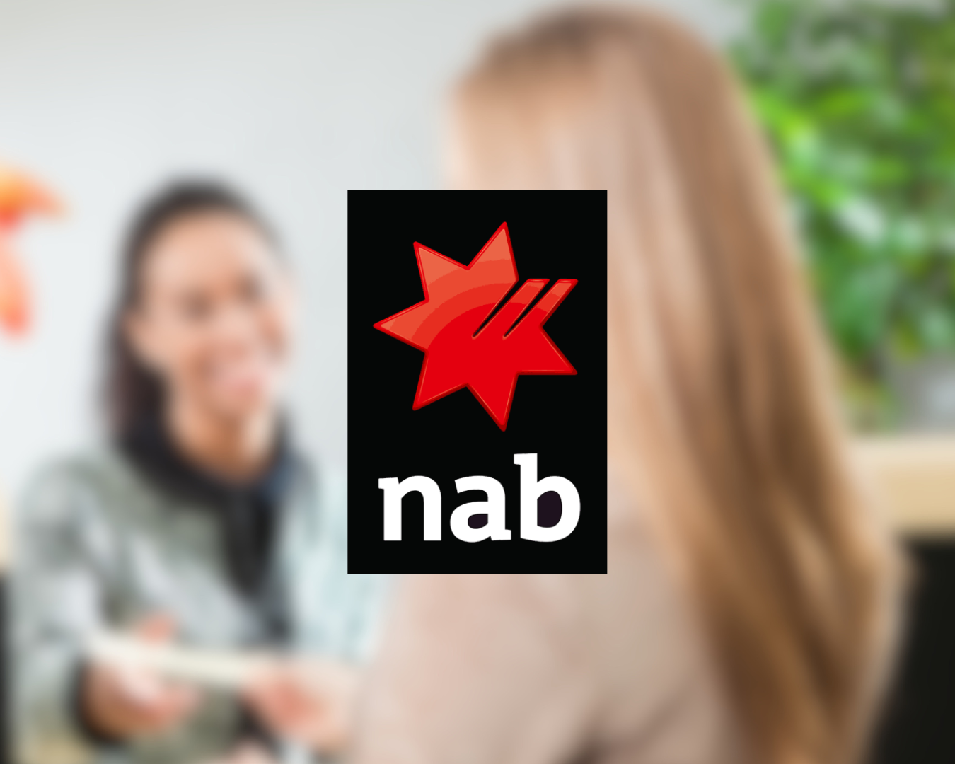Blurred photo of two women talking indoors, with a large NAB logo overlayed in the center.