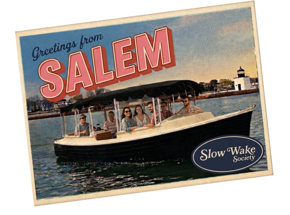 Vintage-style Greetings from Salem postcard featuring a Duffy electric boat cruise on Salem Harbor with Derby Wharf Lighthouse – Slow Wake Society
