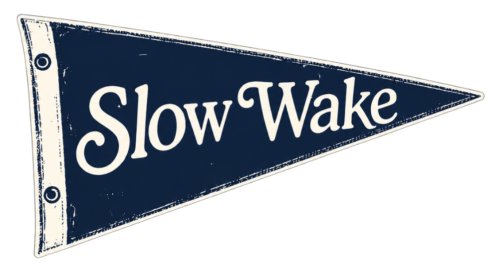 Blue pennant flag with white letters reading "Slow Wake".
