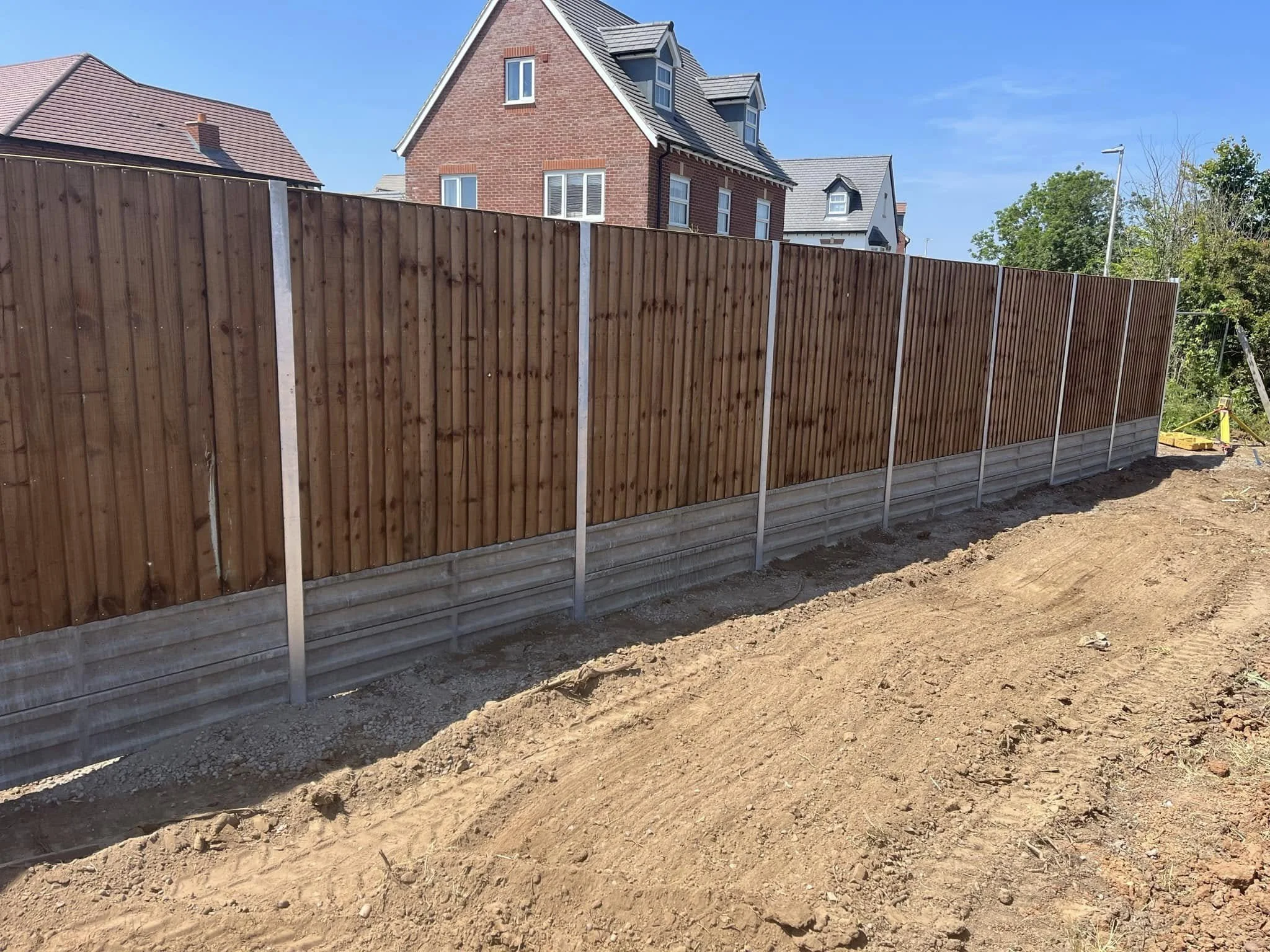 Wooden domestic fence installation