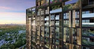 Singapore condo - High-rise apartment building with glass balconies and windows, overlooking a cityscape at sunset.