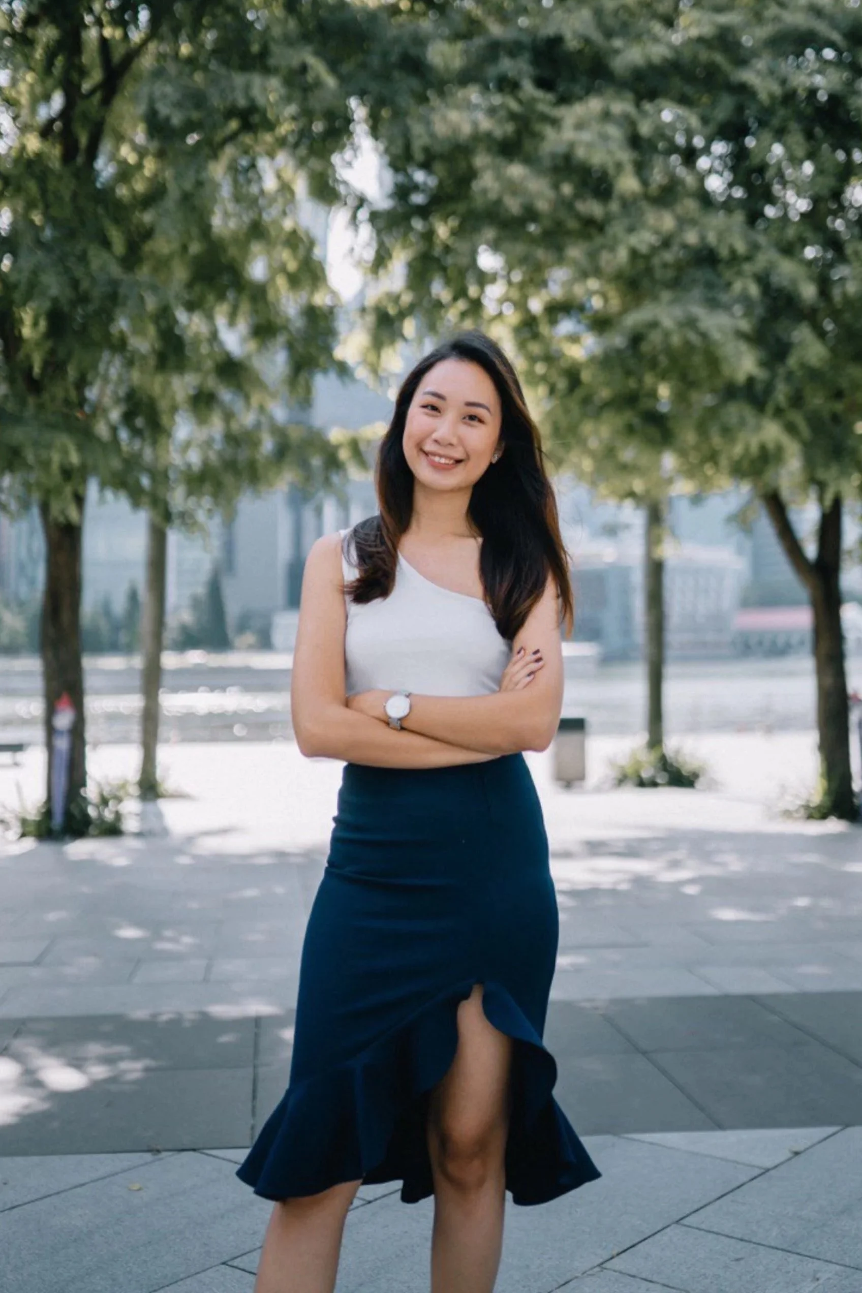 Agatha Neo, Propnex Singapore Top 1% real estate agent, crossing her arms and posing for the photo.