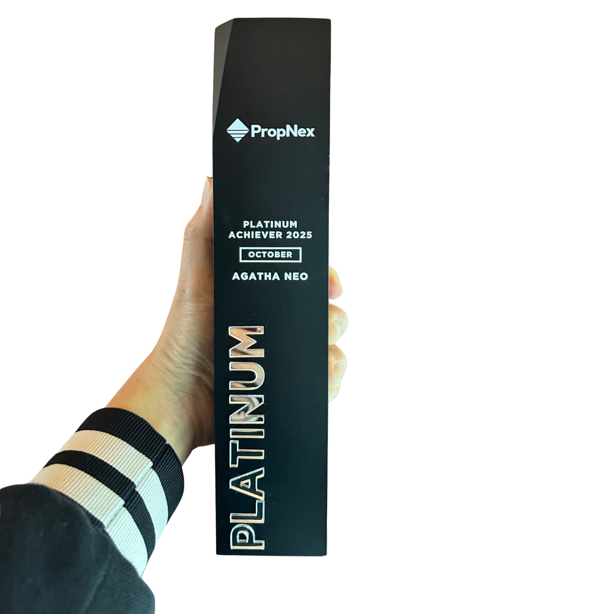 Agatha Neo, holding a black award plaque with the PropNex logo and text indicating top achievement for October 2025.