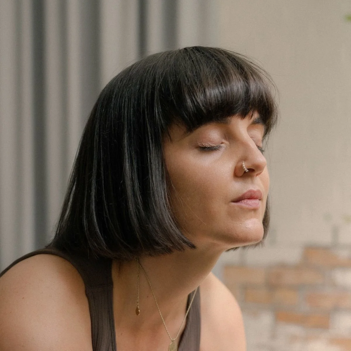 Woman practising Mellow Flow yoga at I Am That Studio in Collingwood, Melbourne.