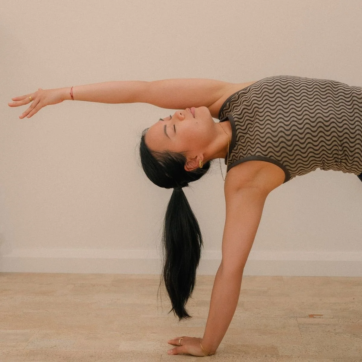 Student practising Wild Thing pose in a Power Flow Yoga class at I Am That Studio in Collingwood, Melbourne.