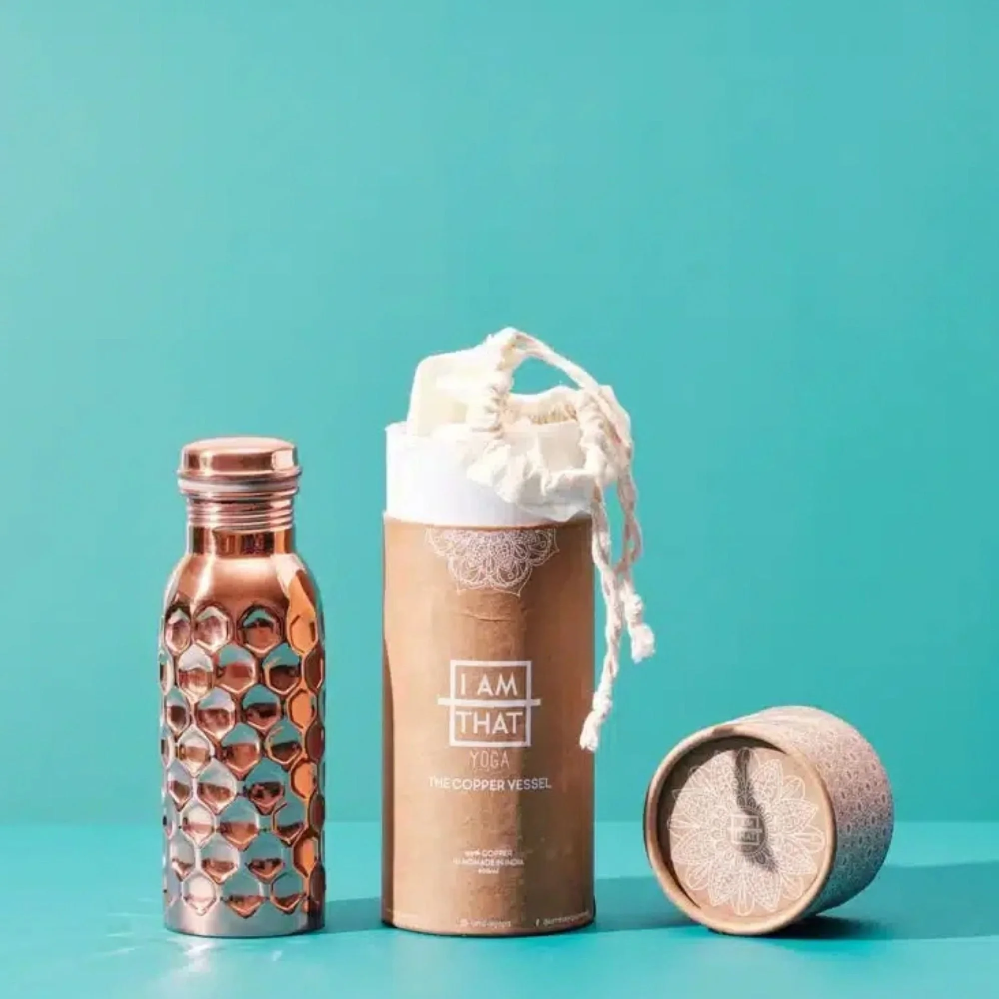 Hammered 900ml copper water bottle with cotton carry bag at I Am That Studio.