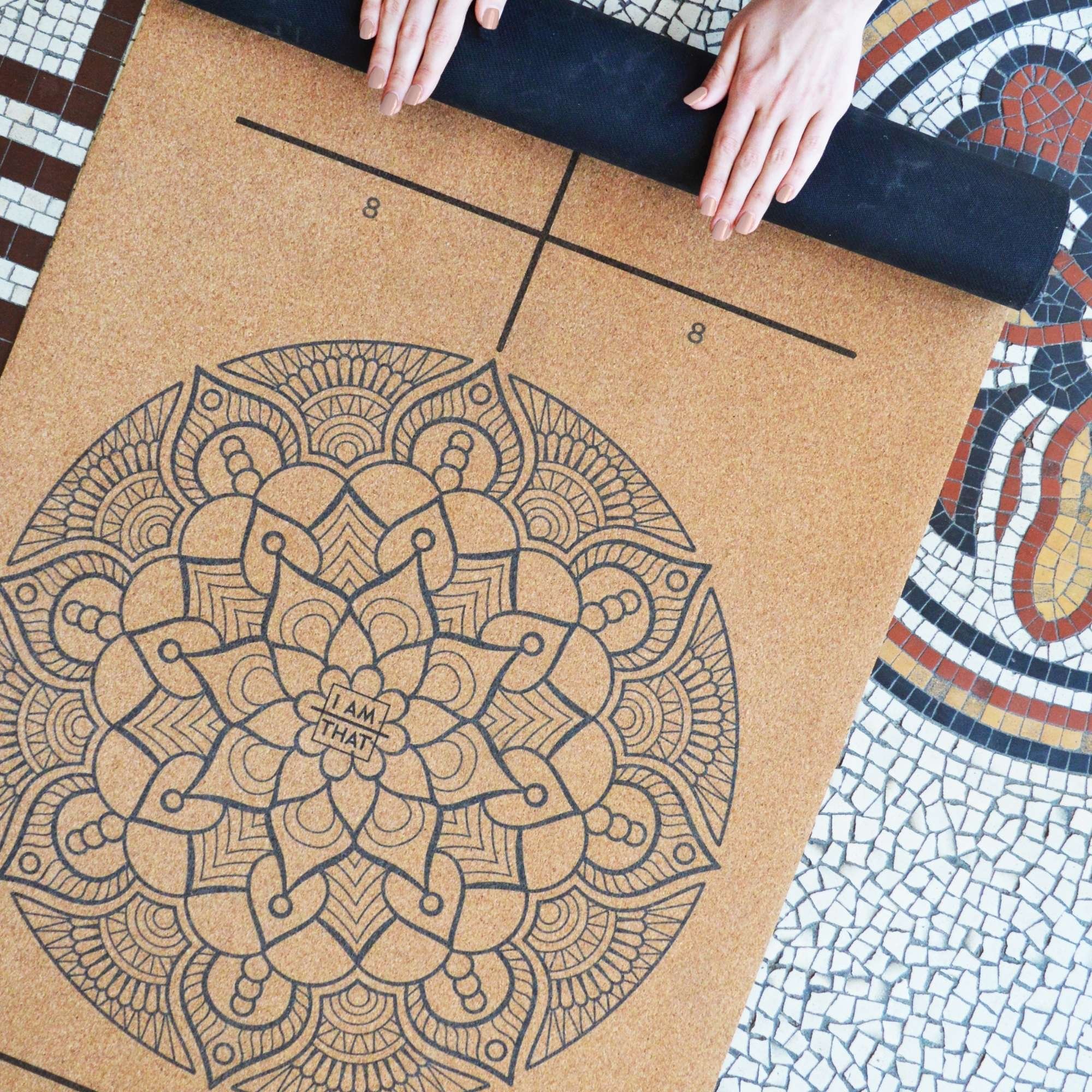 Close-up of natural cork alignment guides on travel yoga mat
