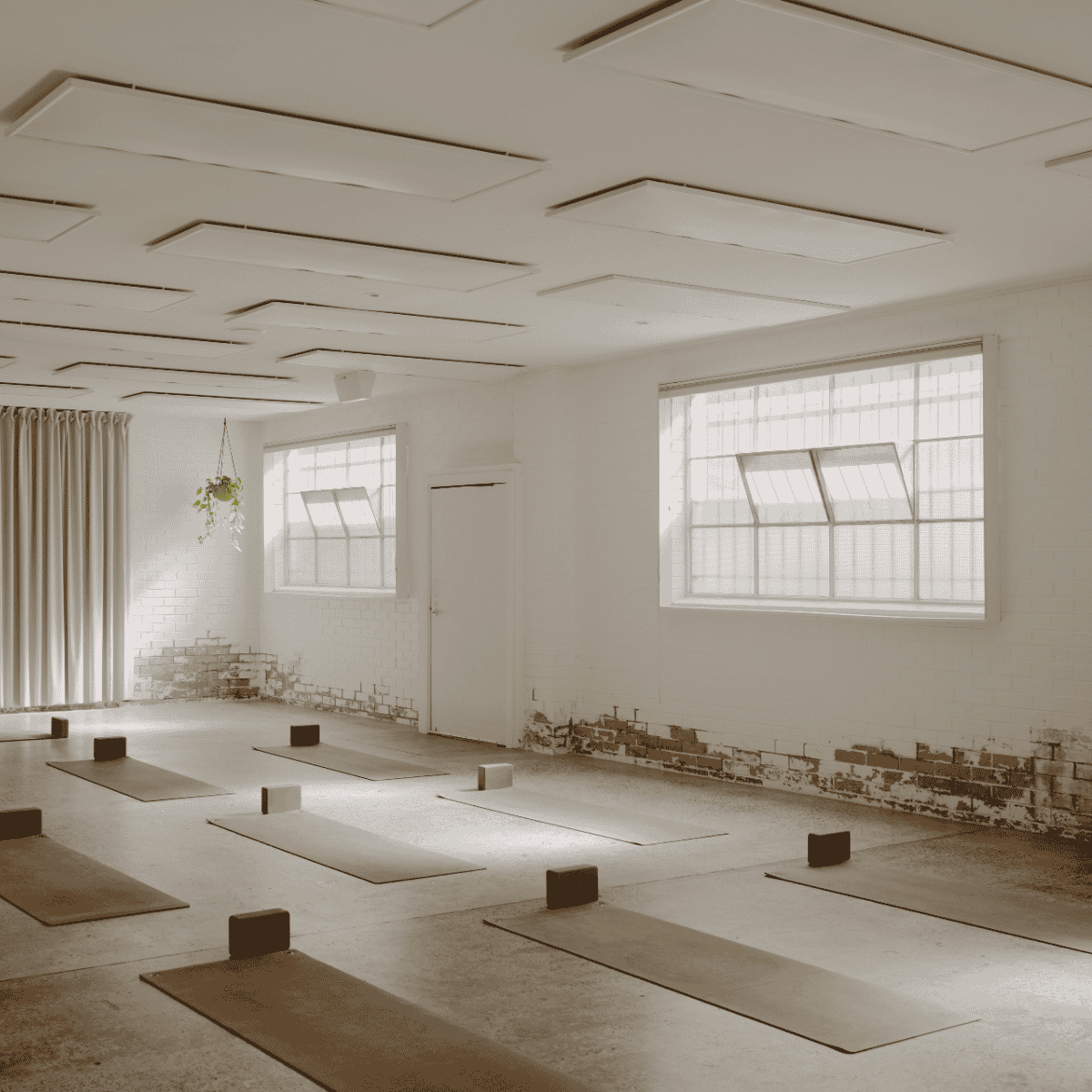 Light-filled Yoga studio prepared for a Yoga class at I AM THAT STUDIO in Collingwood, Melbourne.