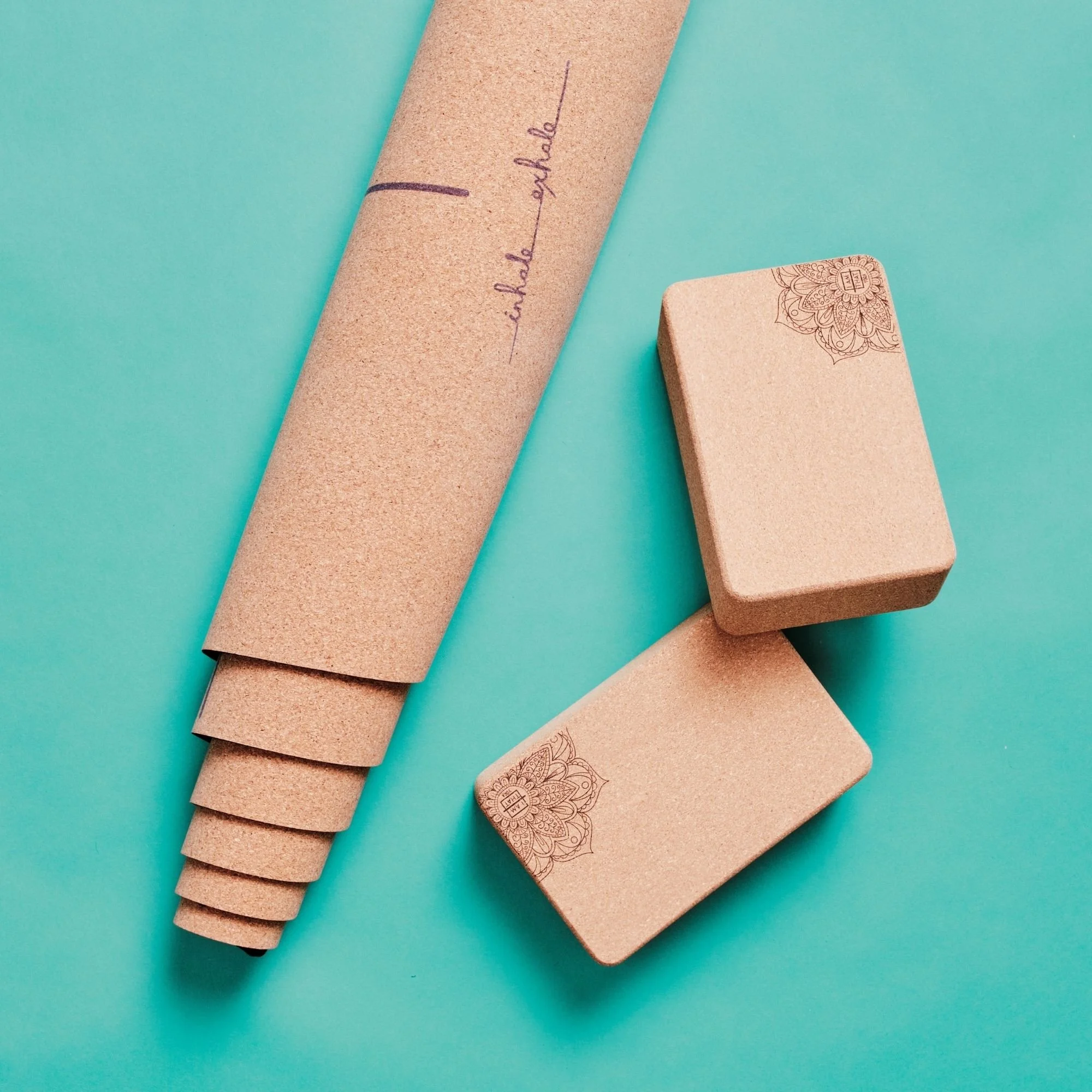 Natural cork yoga blocks alongside a cork yoga mat for a sustainable yoga practice | I Am That Studio