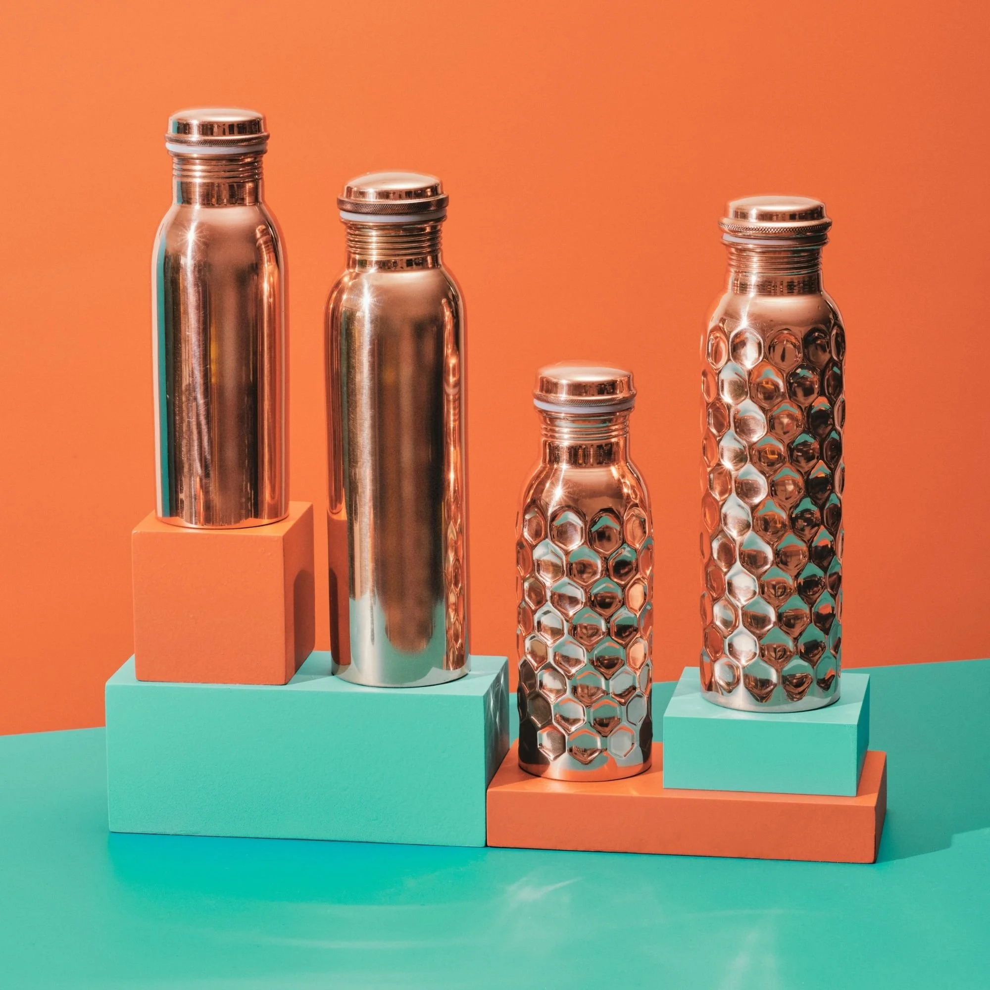 Smooth and hammered copper water bottles in 600ml and 900ml sizes at I Am That Studio.