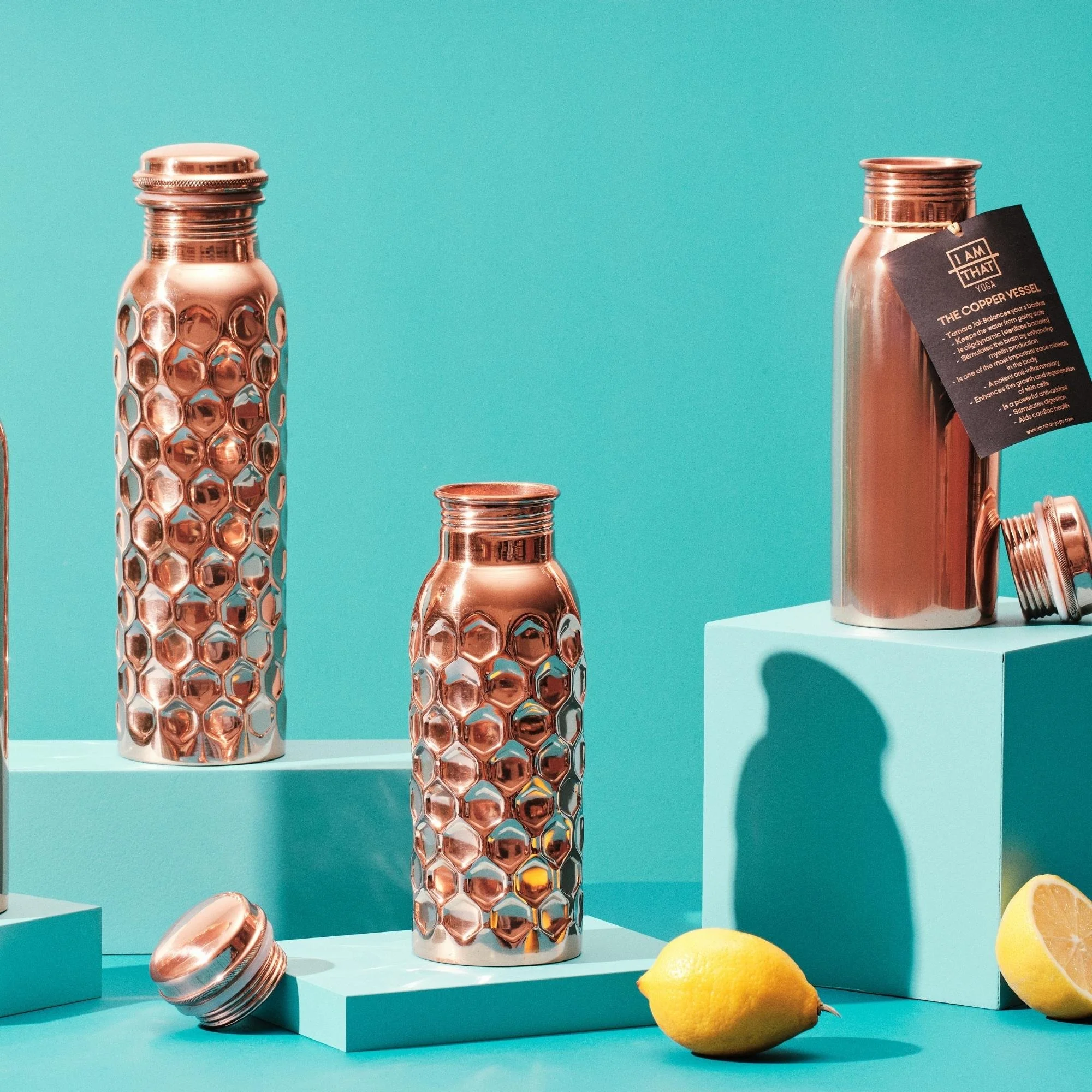 Smooth and hammered copper water bottles in 600ml and 900ml sizes at I Am That Studio.
