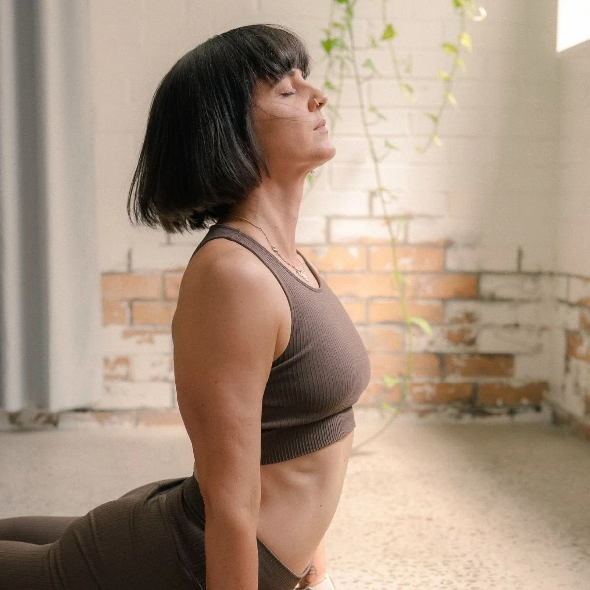 Student practising Upward Facing Dog in a Vinyasa Flow Yoga class at I Am That Studio in Collingwood, Melbourne.