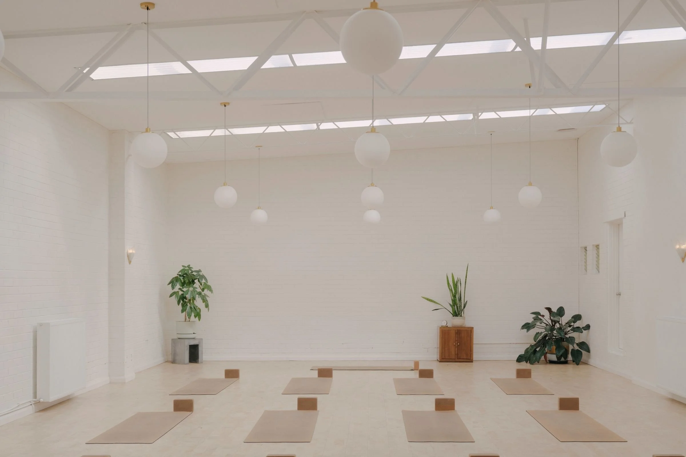 Bright yoga studio at I Am That Studio in Collingwood, Melbourne, prepared for yoga workshops, events and wellness sessions.