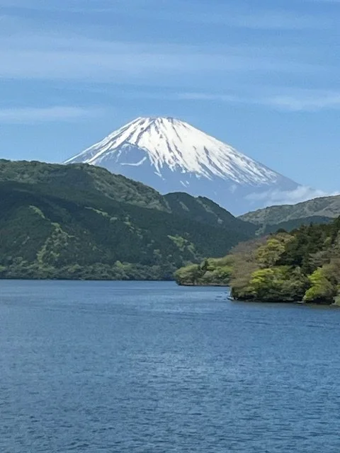 Mount Fuji rising above a lake with forested hills in the foreground, representing the Northern Japan Textile Journey experience