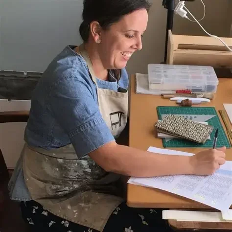 Anne Covell in studio, preparing materials for handmade paper and bookbinding workshop