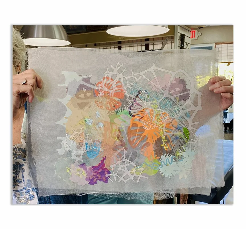 student holding work up in Valerie Goodwin workshop