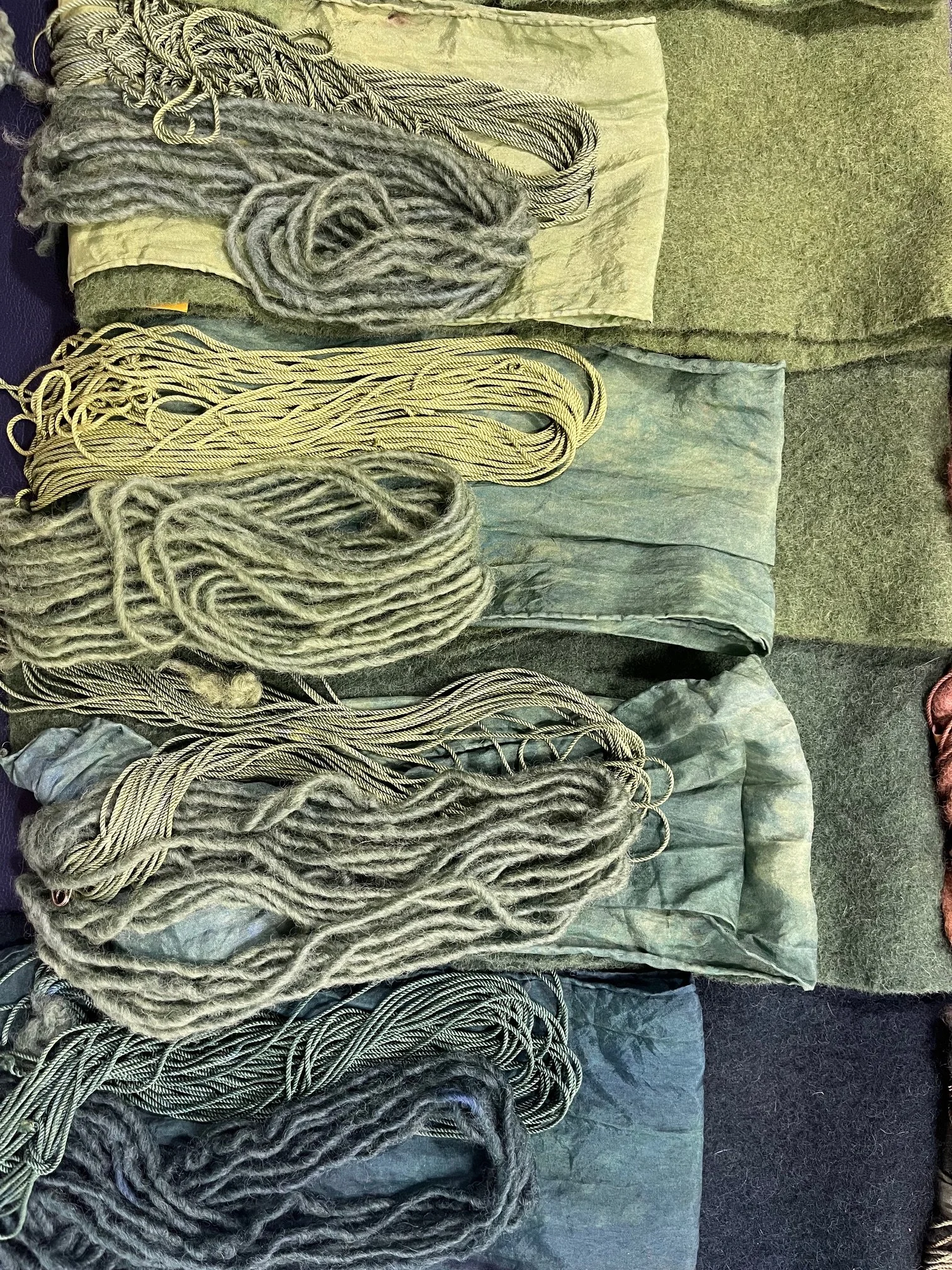 Muted grey natural dyed textiles showing subtle tonal variation from eco dye and mordant processes