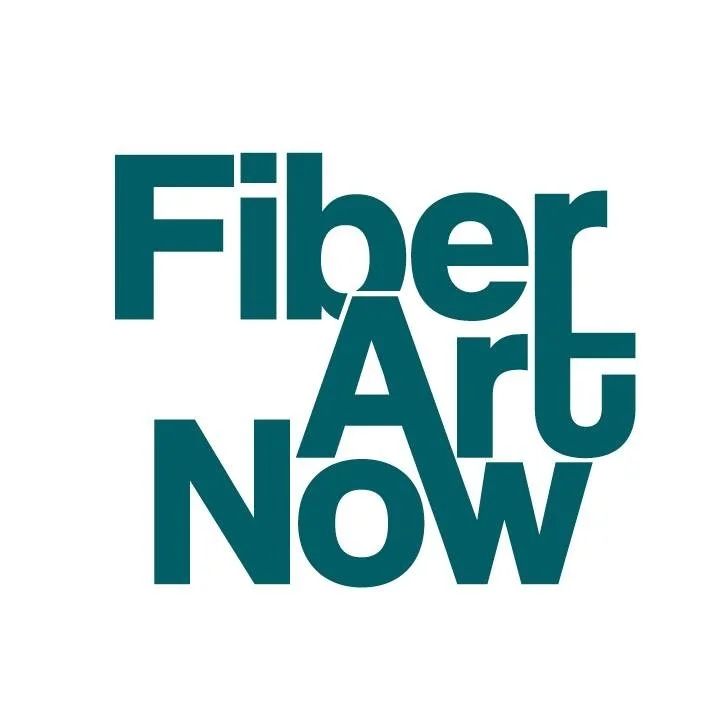 Text saying 'Fiber Art Now' in large, bold, teal lettering on a white background.