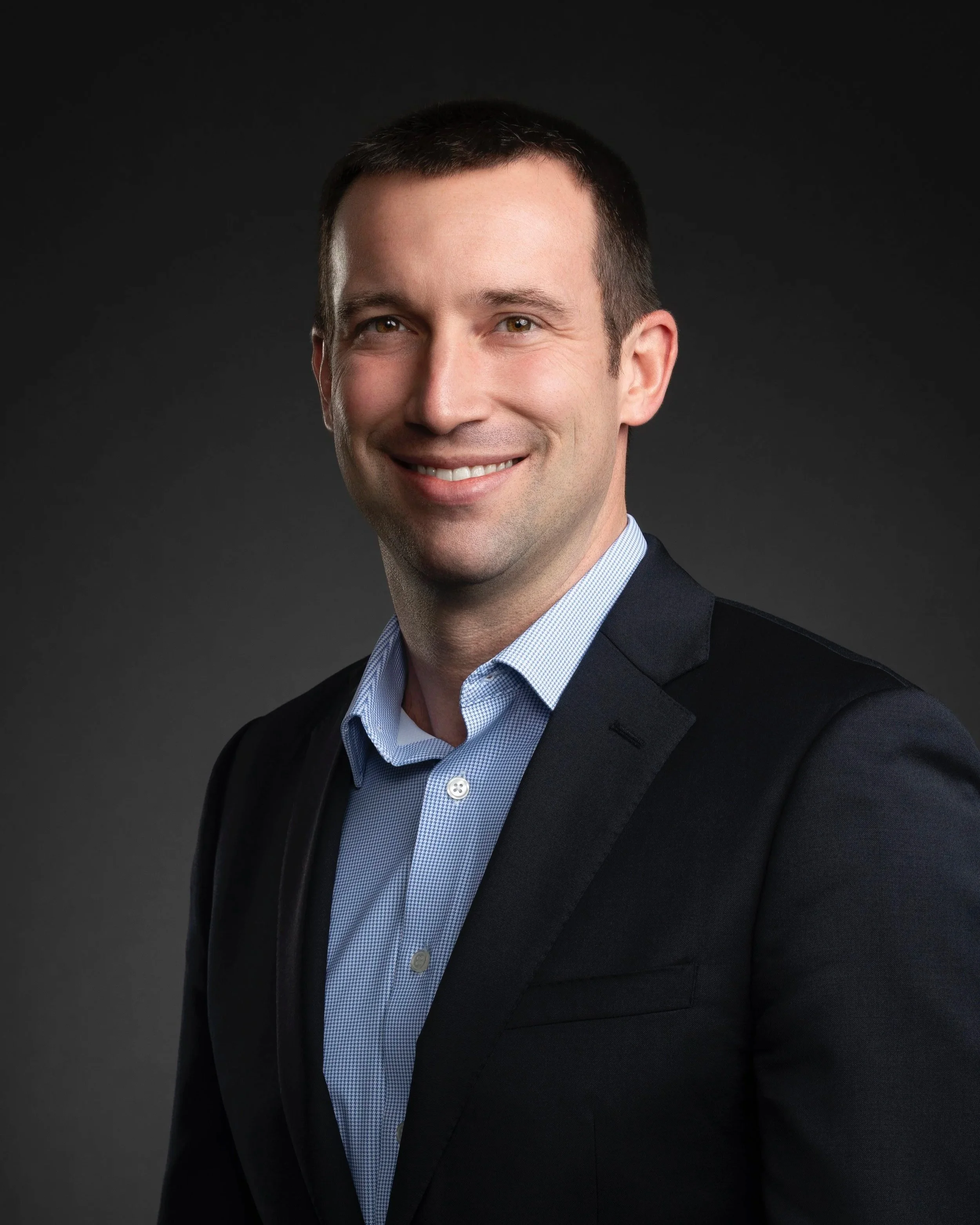 A professional headshot of Ryan Sauber, MD, an endoscopic and minimally invasive spine surgeon.