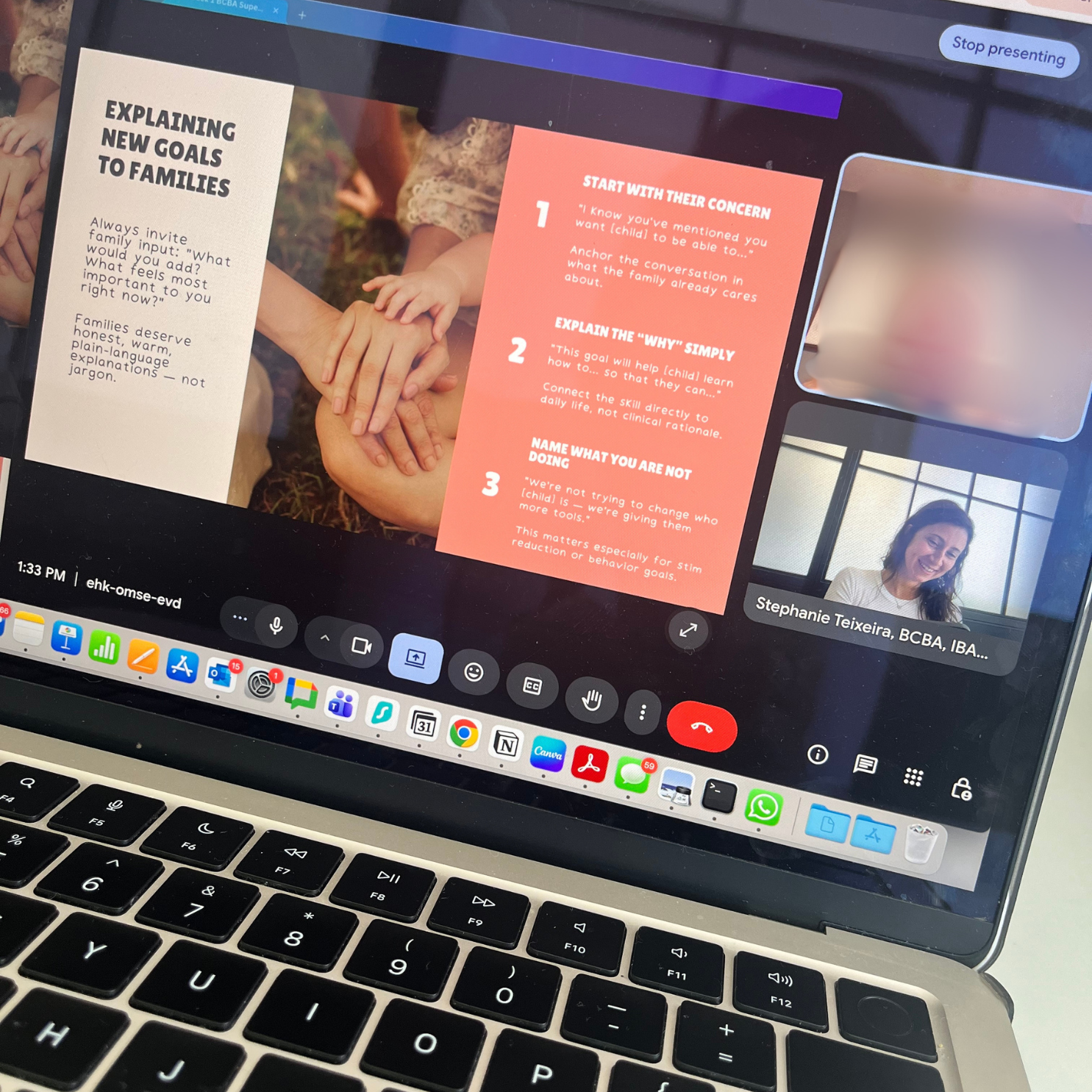 A laptop screen showing a video call or presentation with a slide titled "Explaining New Goals to Families," a woman smiling in the bottom right corner, and app icons on the dock at the bottom of the screen.