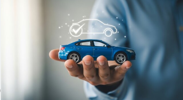 Person holding a miniature blue car with an digital overlay of a car outline and checkmark