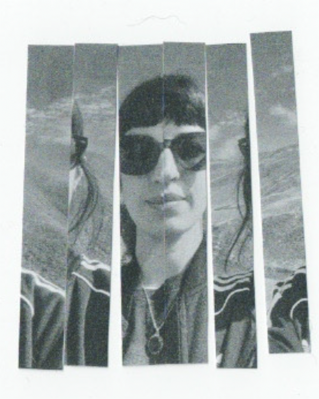 Black and white divided photo collage of a woman with short hair, wearing sunglasses, and a striped jacket, at the beach with waves in the background.
