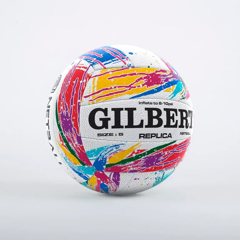 Colorful Gilbert netball with abstract paint splatter design against a white background.