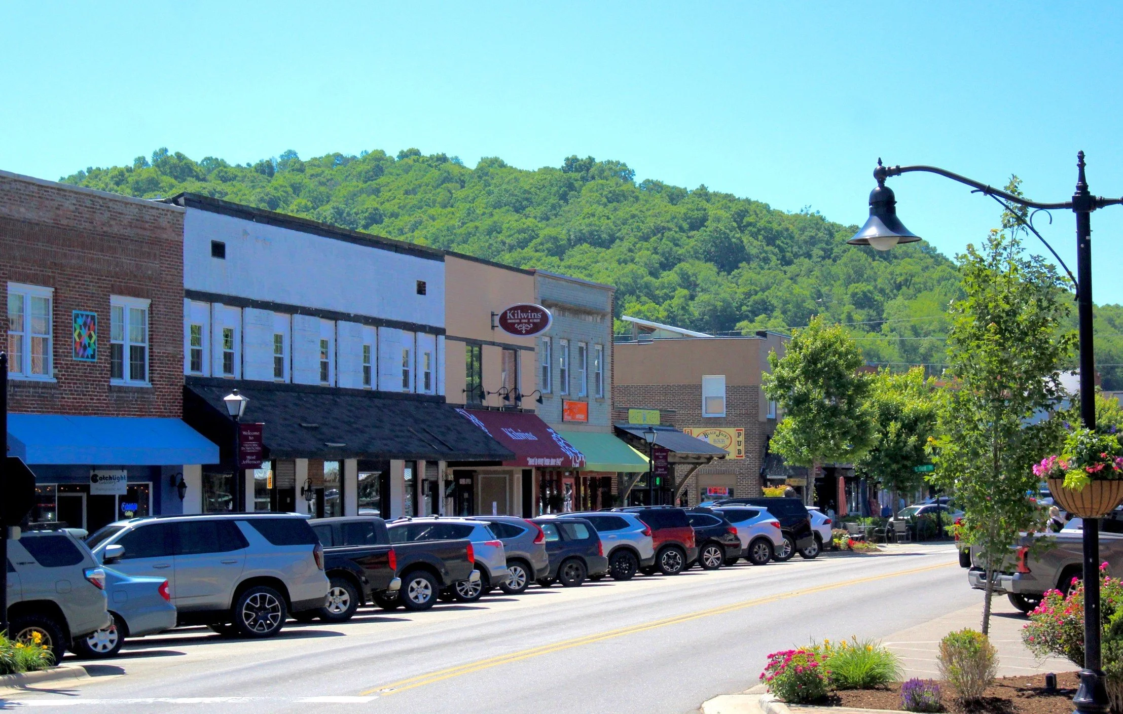 Visitors enjoying the shops, restaurants, galleries, and attractions found throughout the mountain communities of Ashe County in North Carolina's Blue Ridge Mountains.