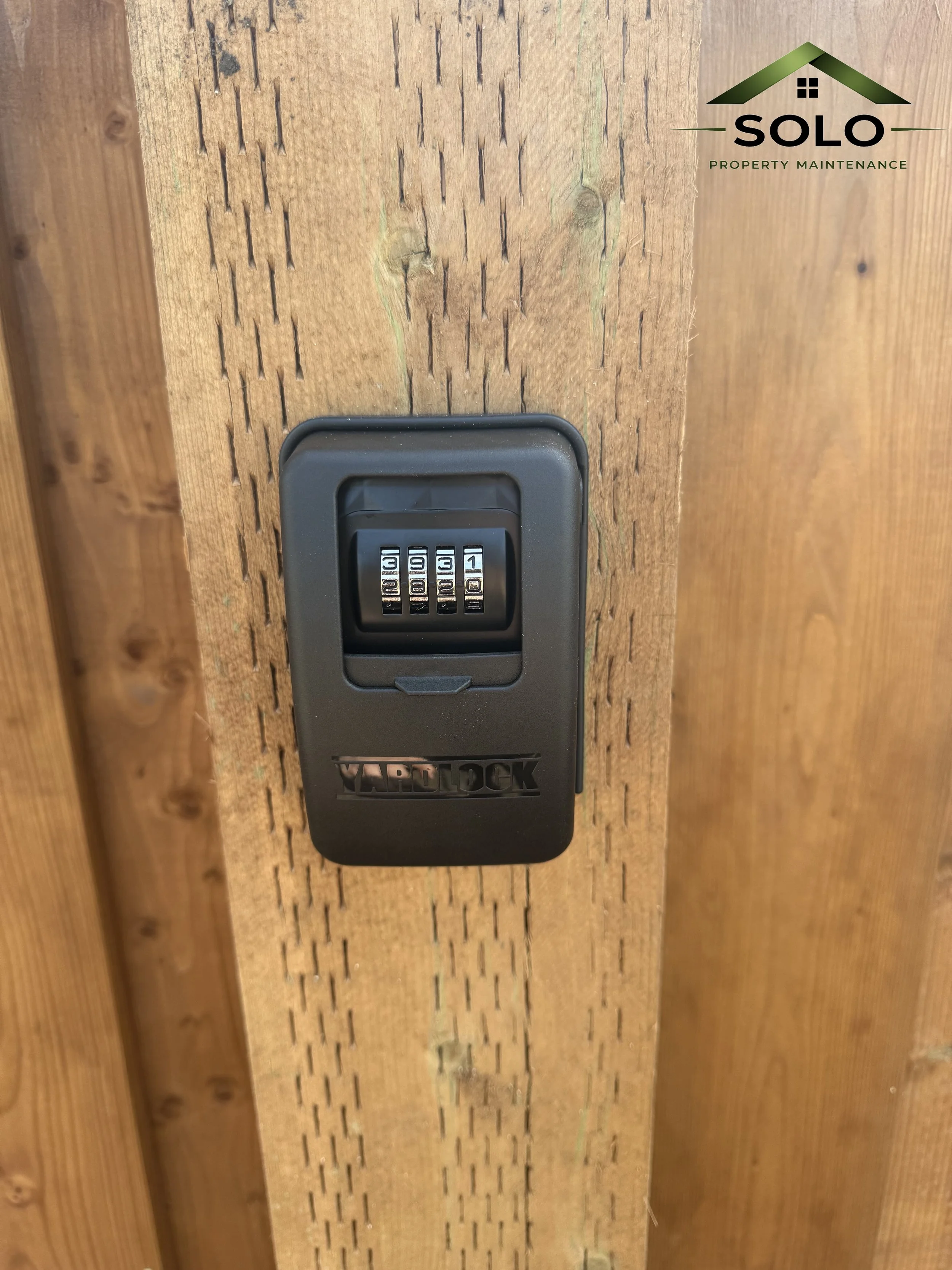 A black combination lock attached to a wooden surface, with the brand name 'VAPLOCK' on it.