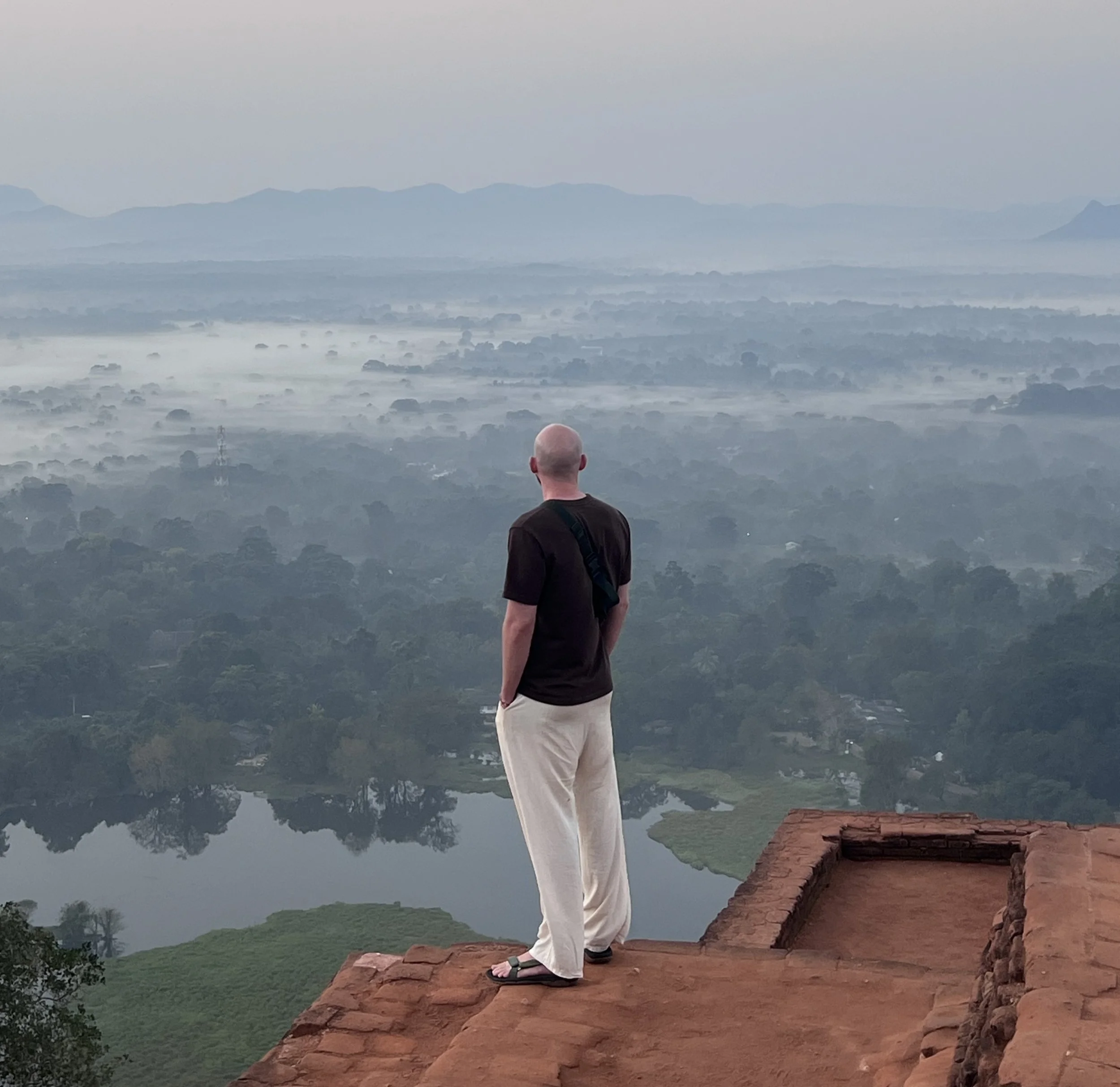 Climbing the Sigiriya Lion Rock fortress stairs at sunrise in Sri Lanka