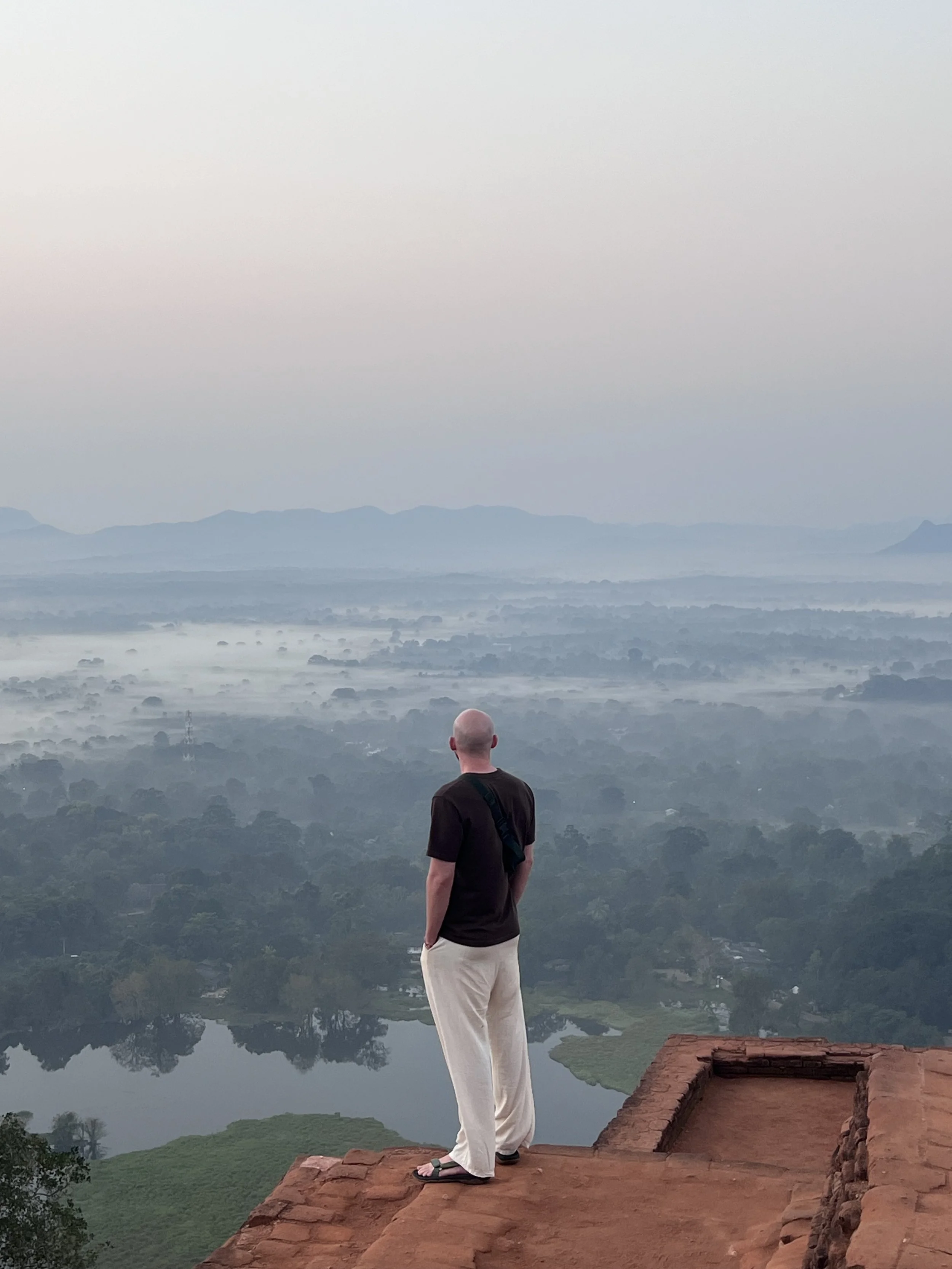 Holocene founder looking out over the Sri Lankan Jungle after climbing a UNESCO site of Sigiriya