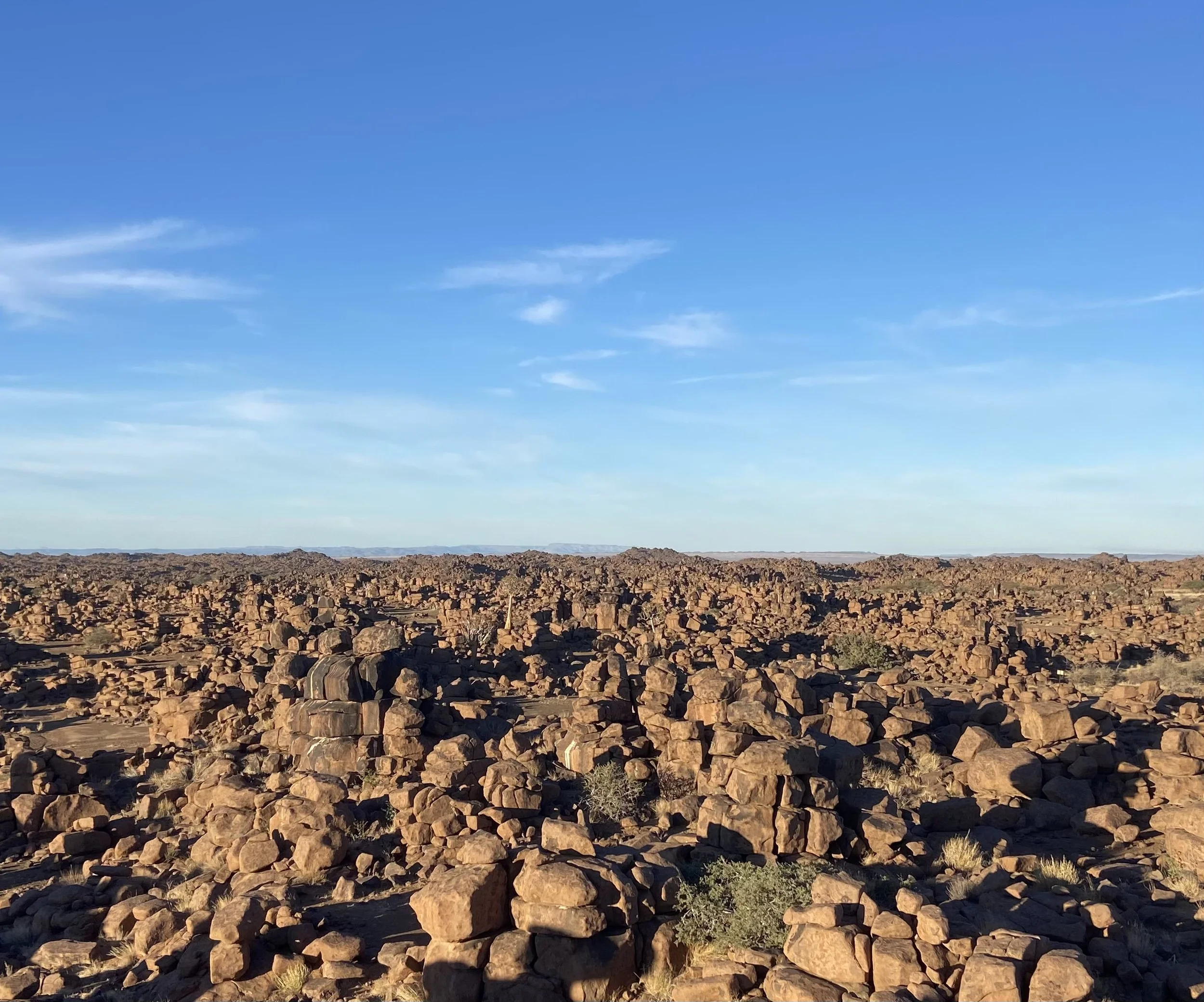 The untamed, boulder-strewn landscape of Giant’s Playground near Keetmanshoop under a clear blue sky.