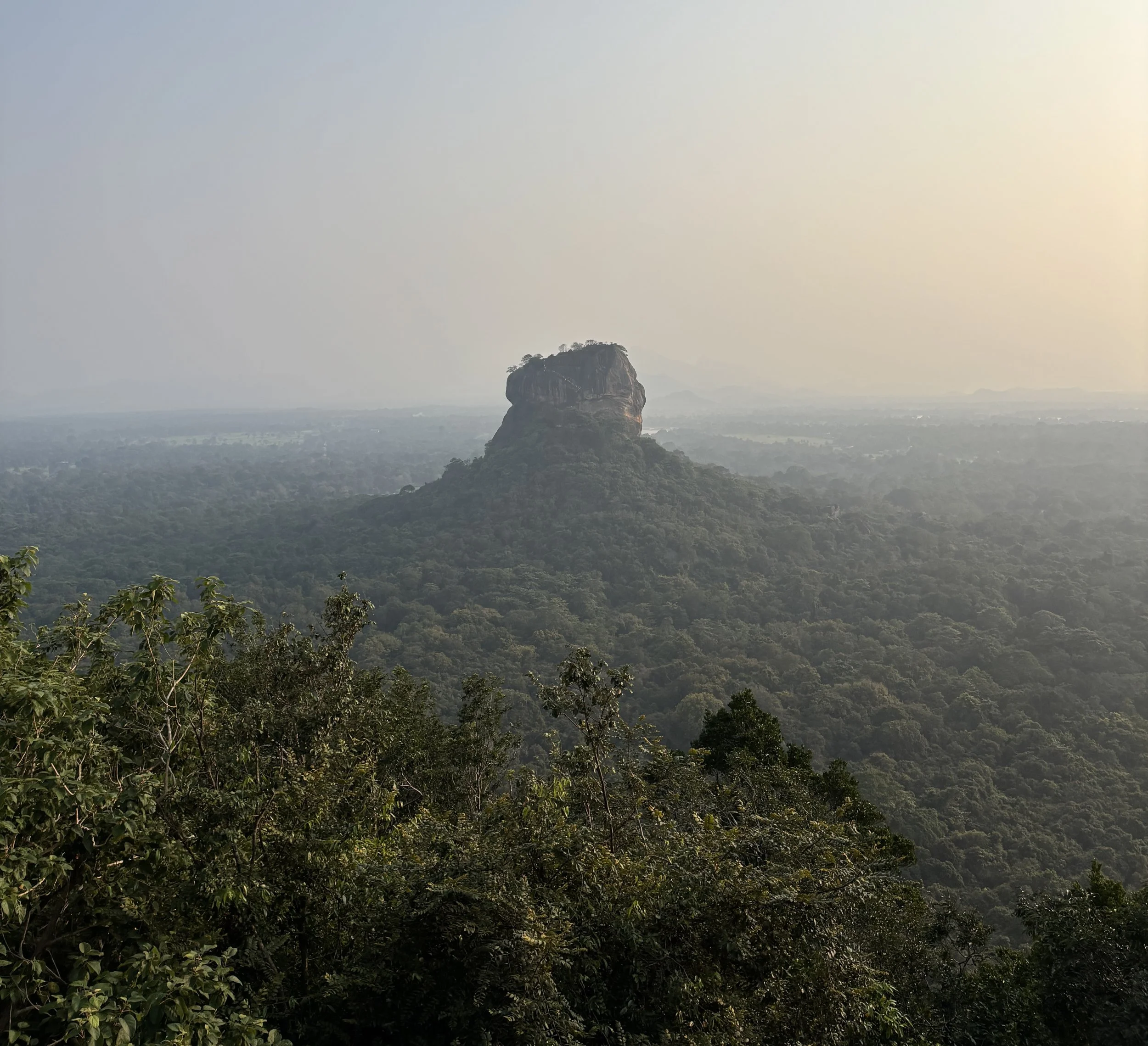 Sigirya rock as seen from Lions Rock at Dusk.