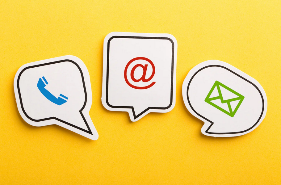 Three speech bubble signs with icons for phone, email, and social media on a yellow background.