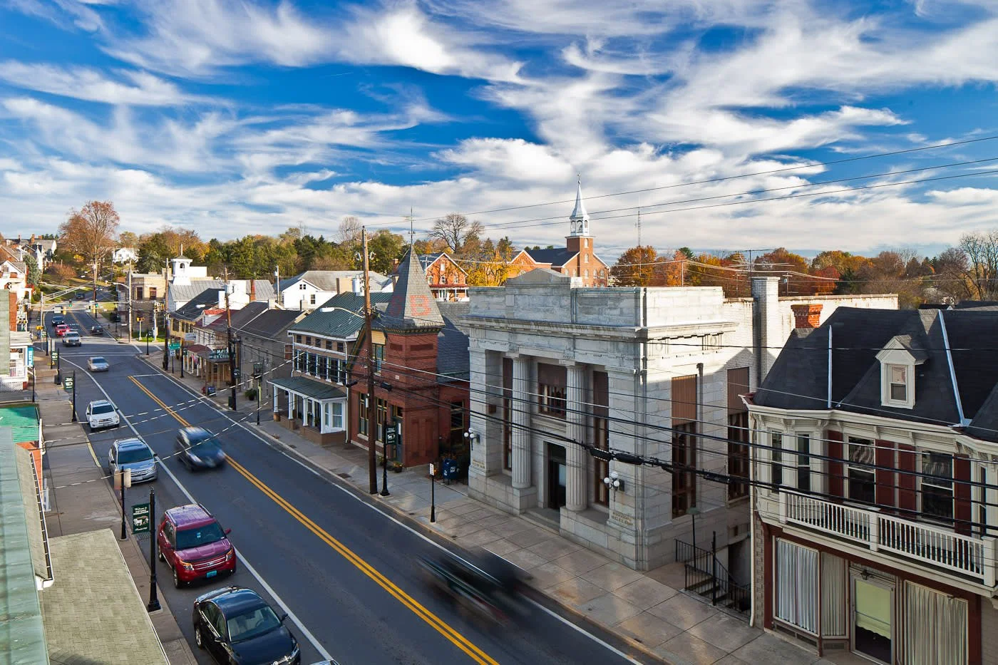 Picture of Main Street, Middletown, Maryland with government buildings, homes, and cars.