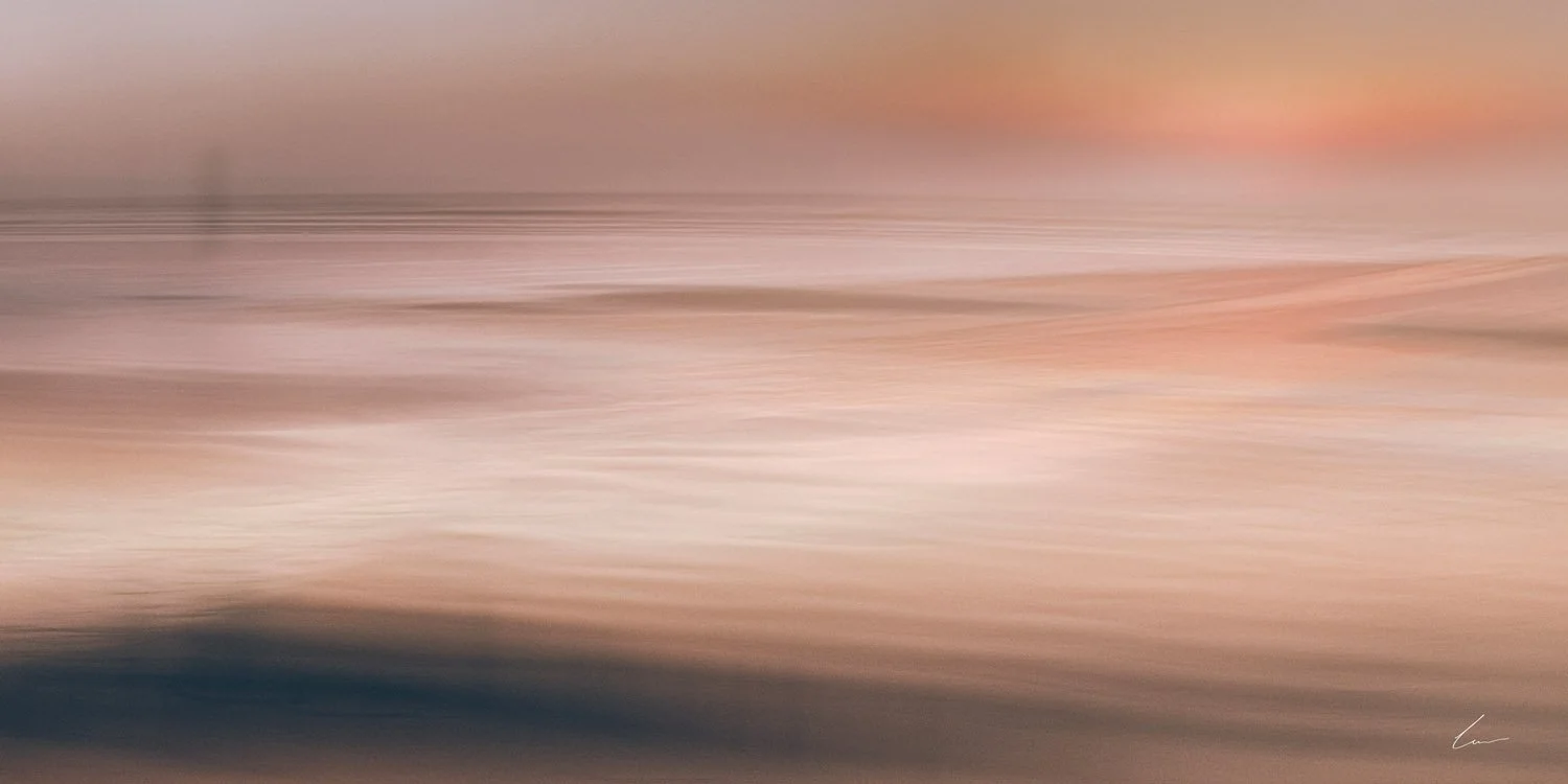Abstract blurred image with horizontal streaks in shades of pink, beige, brown, and dark blue.