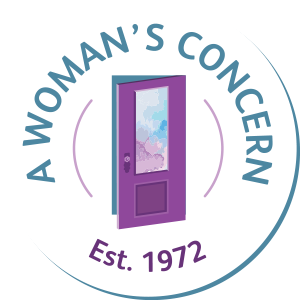 A logo featuring a purple door with a sky and clouds reflected in its window, encircled by the text "A WOMAN'S CONCERN" and "Est. 1972."