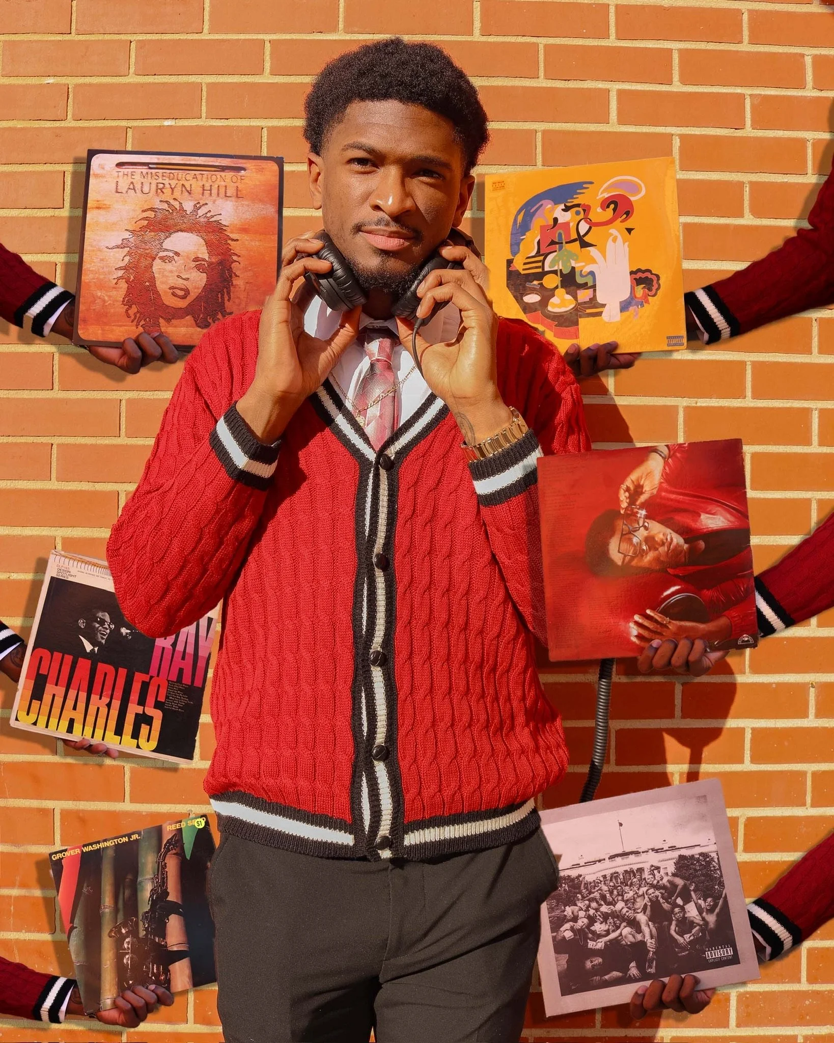 A man in a red sweater and tie is standing in front of a brick wall, holding headphones. Multiple hands around him are holding vinyl album covers featuring jazz and soul artists and album art.