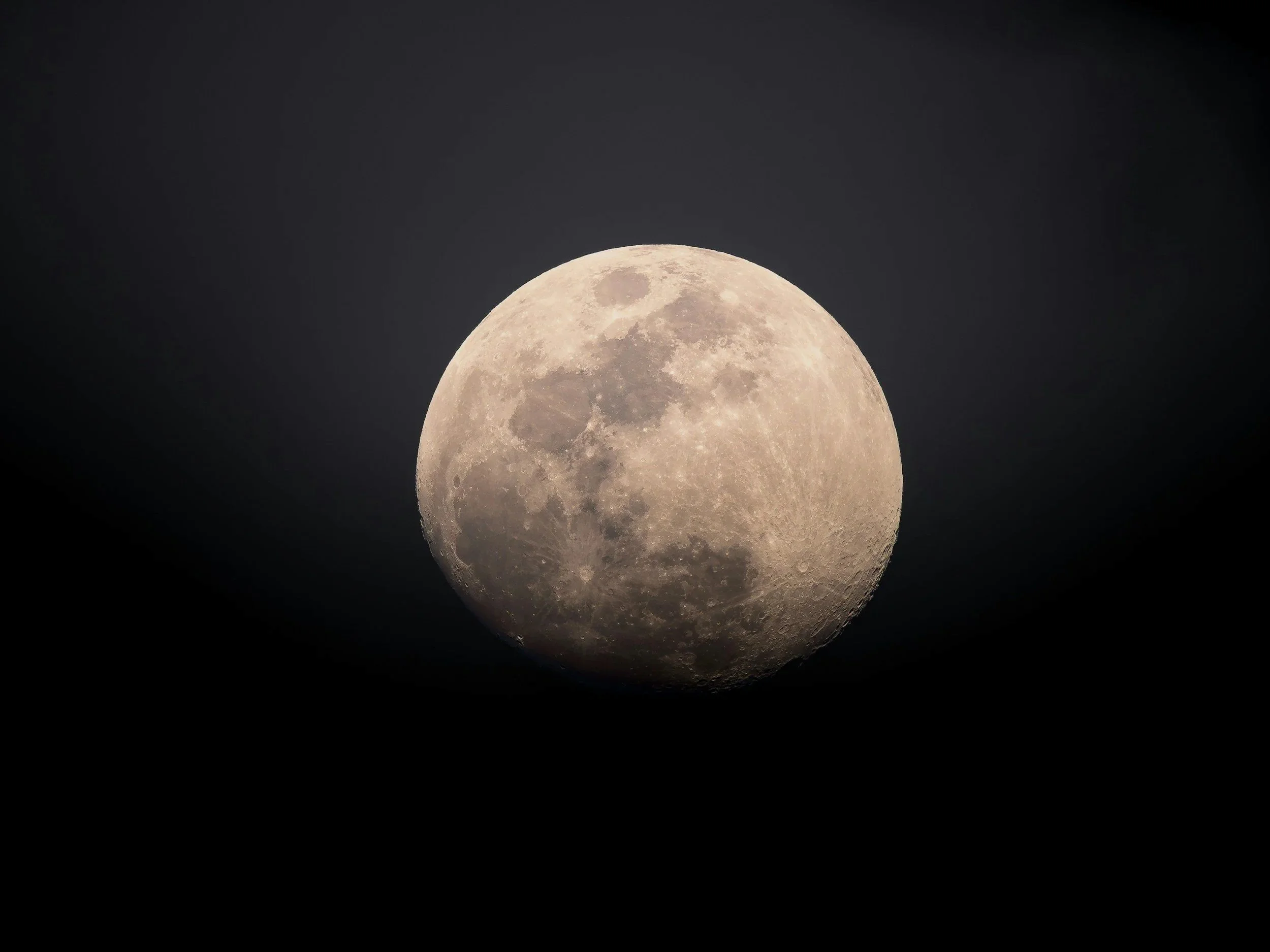 Full moon against dark night sky.
