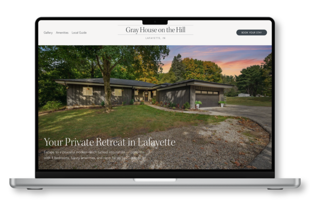 Computer mockup showing website design for Gray House on the Hill Airbnb rental property
