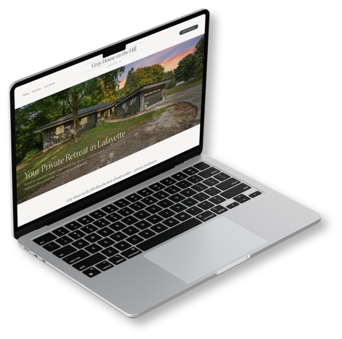 Computer mockup showing website design for Gray House on the Hill Airbnb rental property